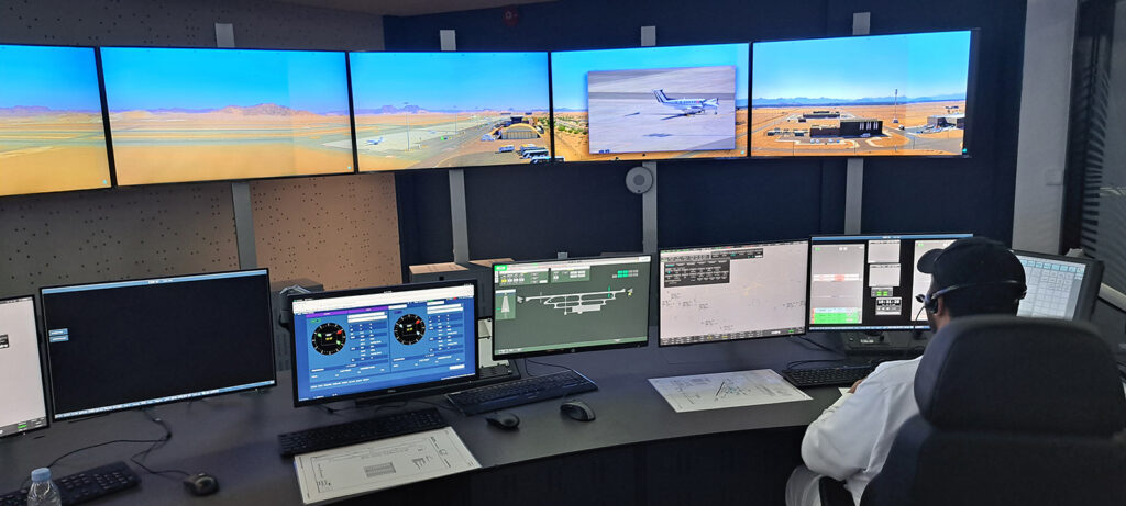 Monitors are lined up in rows, displaying data and video at the new air traffic control tower.